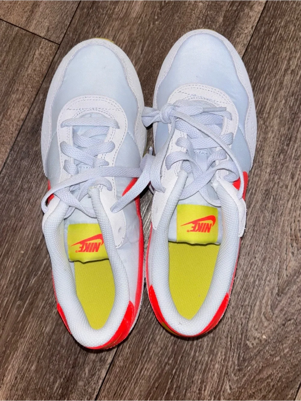 Nike Kids White Sneakers with Neon Pink Swoosh and Yellow Outsole
